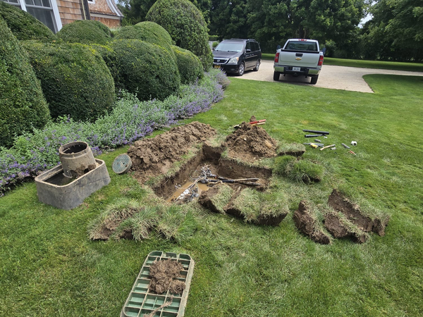Sod lifted to reach a valve box